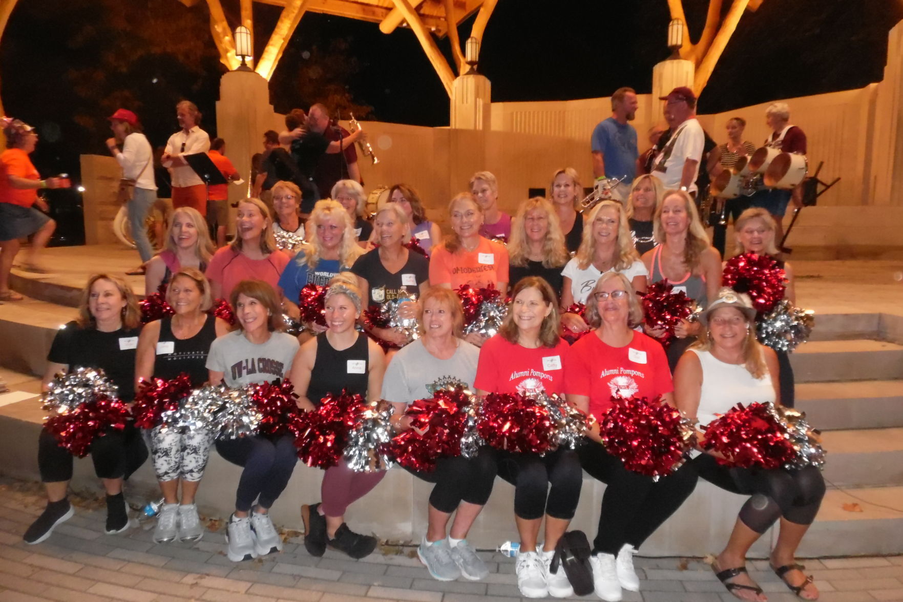 Pom pom girls relax after practice